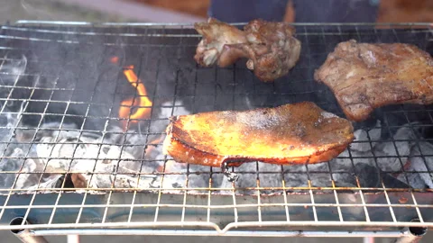 Meat grilling fire flame on party background for cooking, close up view Vídeos de archivo 145845057