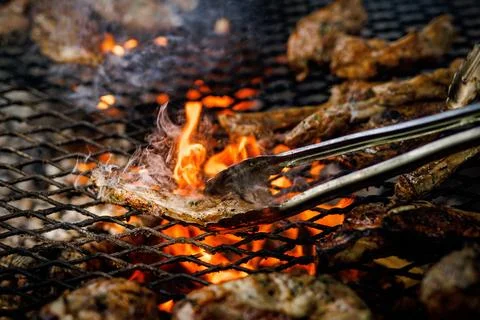 Meat Grilling Over Open Flame Stock Photos