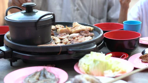 Meat grilling on pan and soup in pot for people family eating food delicious  库存影片 148404818
