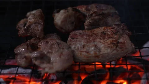 Meat grilling on slow motion fire flame on night background 스톡 동영상 235552879