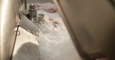 Meat grinder auger moving minced pork inside sausage production, Slow Motion Stock Footage 340005870