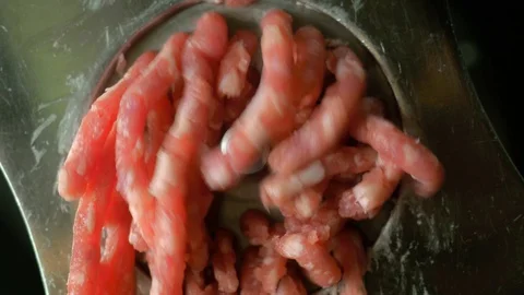 Meat grinder cuts meat closeup Vídeo Stock 112002612