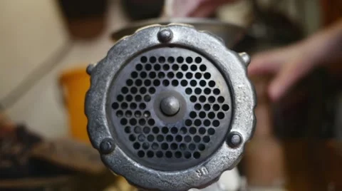 Meat grinder grinding meat in slow motion Stock Footage 44298341