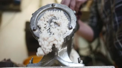 Meat grinder grinding meat in slow motion Stock Footage 44324699