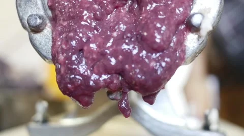 Meat grinder grinding meat in slow motion Stock Footage 44324706