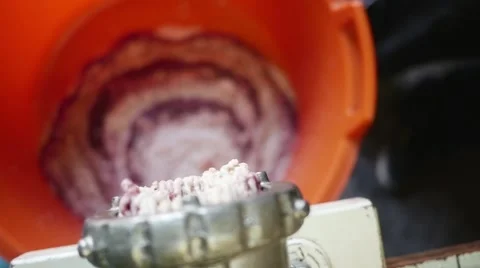 Meat grinder grinding meat in slow motion Stock Footage 44324746
