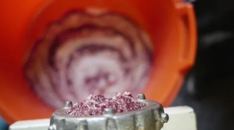 Meat grinder grinding meat in slow motion Stock Footage 44324773