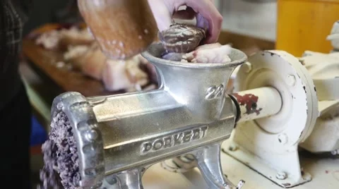 Meat grinder grinding meat in slow motion Stock Footage 44324799