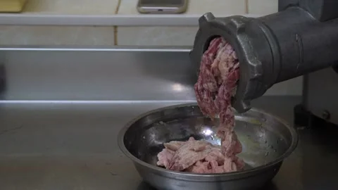 A meat grinder grinds the meat. chopping beef and pork for making cutlets Stock Footage 144567329