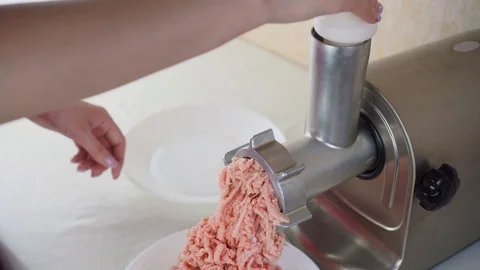 A meat-grinder grinds meat. Stock Footage 129751750
