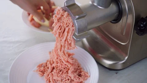 A meat-grinder grinds meat. Stock Footage 130099522