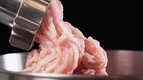 Meat grinder, grinds the meat into minced meat. Minced chicken. Stock Footage 126752079