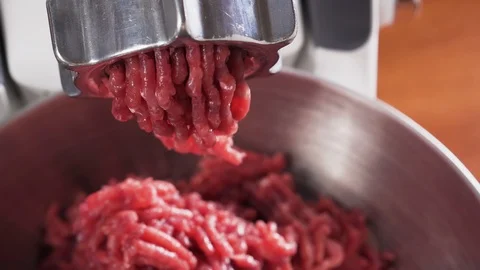 Meat grinder, grinds the meat into minced meat. Minced beef. Video stock 126752188