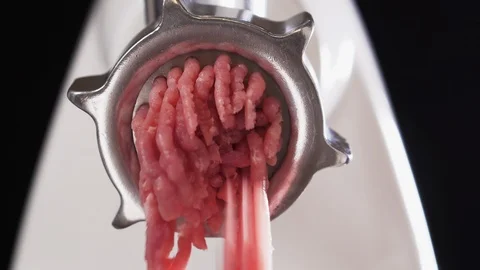 Meat grinder, grinds the meat into minced meat. Minced pork. Stock Footage 126752553