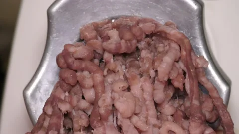 Meat grinder grinds raw meat Stock Footage 143579227