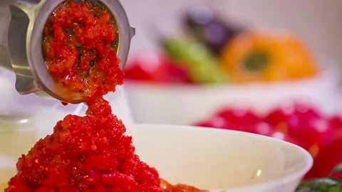 Meat grinder grinds red vegetables Stock Footage 86128246