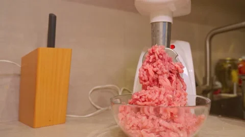 Meat grinder. Making homemade raw minced meat at kitchen. Stock Footage 166439984