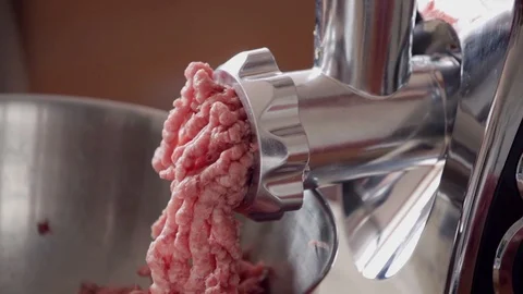 Meat grinder - mincing pork and beef, close-up Stock Footage 107877758