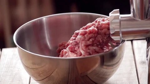 Meat grinder - mincing pork and beef, close-up Stock Footage 107879875