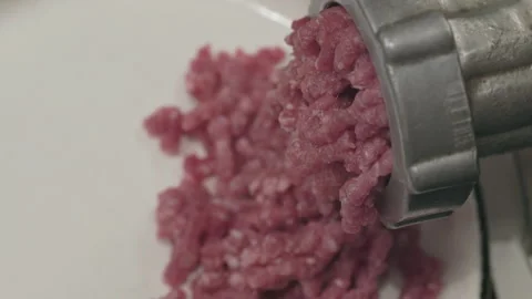 Meat grinder with pork or beef with cooking bowl. Selective focus. Stock Footage 295529048