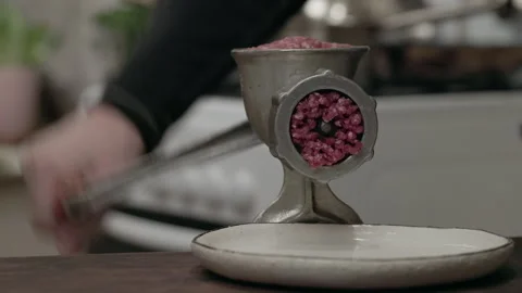 Meat grinder with pork or beef with cooking bowl in the domestic kitchen. Stock Footage 301774942