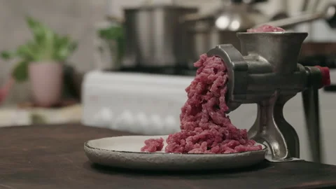 Meat grinder with pork or beef with cooking bowl in the domestic kitchen. Stock Footage 301775030