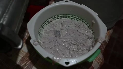 Meat grinder processing ground meat into natural sausage casings Stock-Footage 320407480