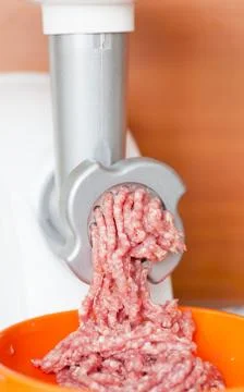 Meat grinder at work Fotos Stock