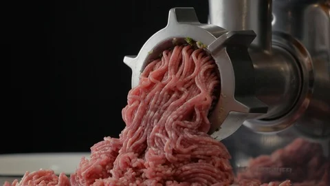 Meat grinding process, meat mincing in black background Stock Footage 126822076