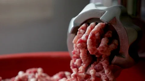 Meat is ground on a meat grinder Video stock 128800969