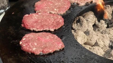 Meat hamburger cutlets close-up fried on an open grill. Stock Footage 253060469