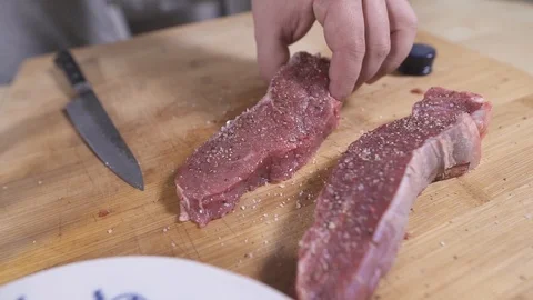 Meat into the hot pen Stock Footage 127124662