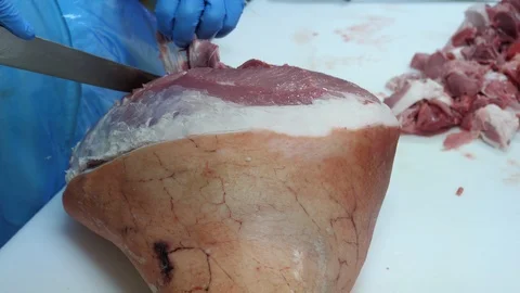 Meat industry, butcher preparing ham in a slaughterhouse. Top view Video stock 90701783