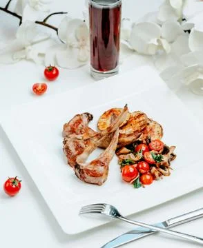 Meat kebab with vegetables on the table Stock Photos