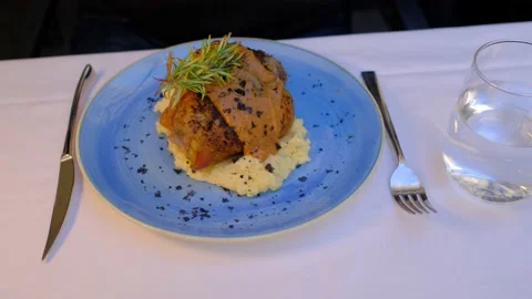 Meat with mashed potatoes in a plate. Close-up, selective focus. Stock Footage 230169381
