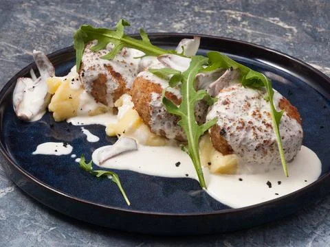 Meat or chicken cutlets with mashed potatoes and mushroom sauce Stock Photos