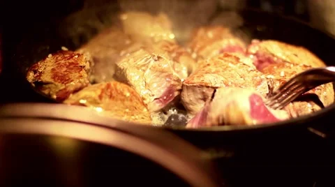 Meat over stove Stock Footage 40339564