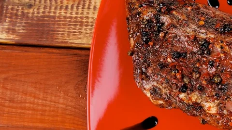 Meat over white : grlled meat shoulder on red plate Video stock 88921806