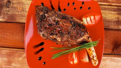 Meat over white : grlled meat shoulder on red plate Video stock 88922028