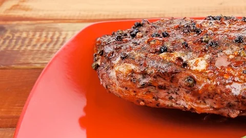 Meat over white : grlled meat shoulder on red plate Video stock 88922088