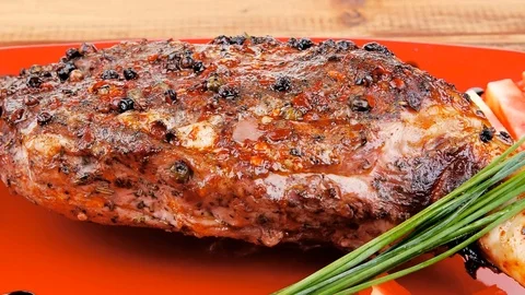 Meat over white : grlled meat shoulder on red plate Video stock 88922162