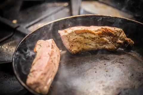 Meat in pan Stock Photos