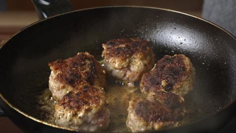 Meat patties or cutlets in form of cutlets, fried in oil in pan, Stock Footage 250765801