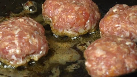 Meat patties or cutlets in form of cutlets, fried in oil in pan, Vídeo Stock 250770734