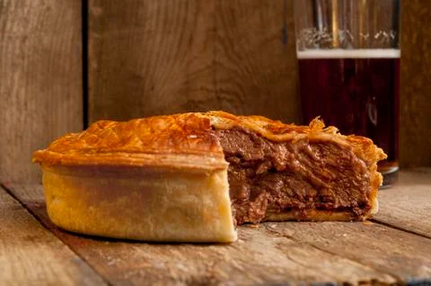 Meat Pie with Missing Slice with Beer Stock Photos