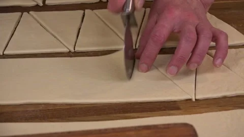 Meat Pies dough being sliced and prepared for baking Stock Footage 239741765