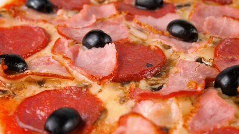 Meat Pizza, salami, bacon, ham, mushrooms and black olives, close-up view Stock Footage 87689543