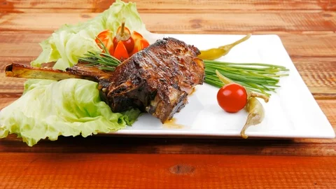 Meat plate on wooden table Video stock 88920758