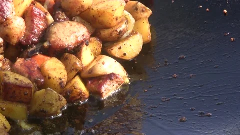 Meat with potatoes and vegetables is fried Stock Footage 163367271