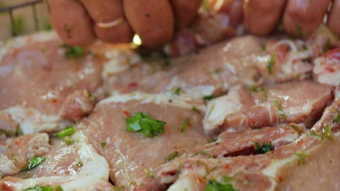 Meat preparing for grilling on charcoal 库存影片 128420313